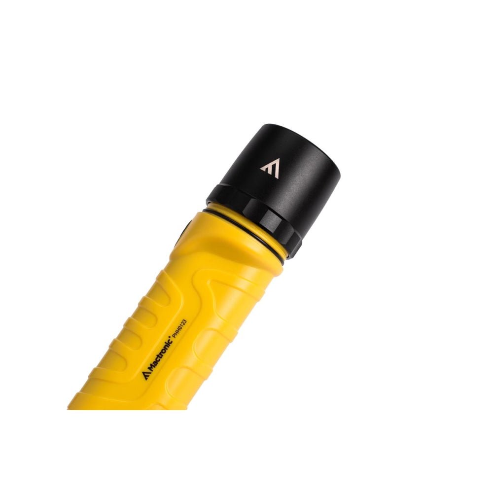 Mactronic Dura Light 2.3 Detail des schwarzen Lampenkopfs auf dem gelben Gehäuse