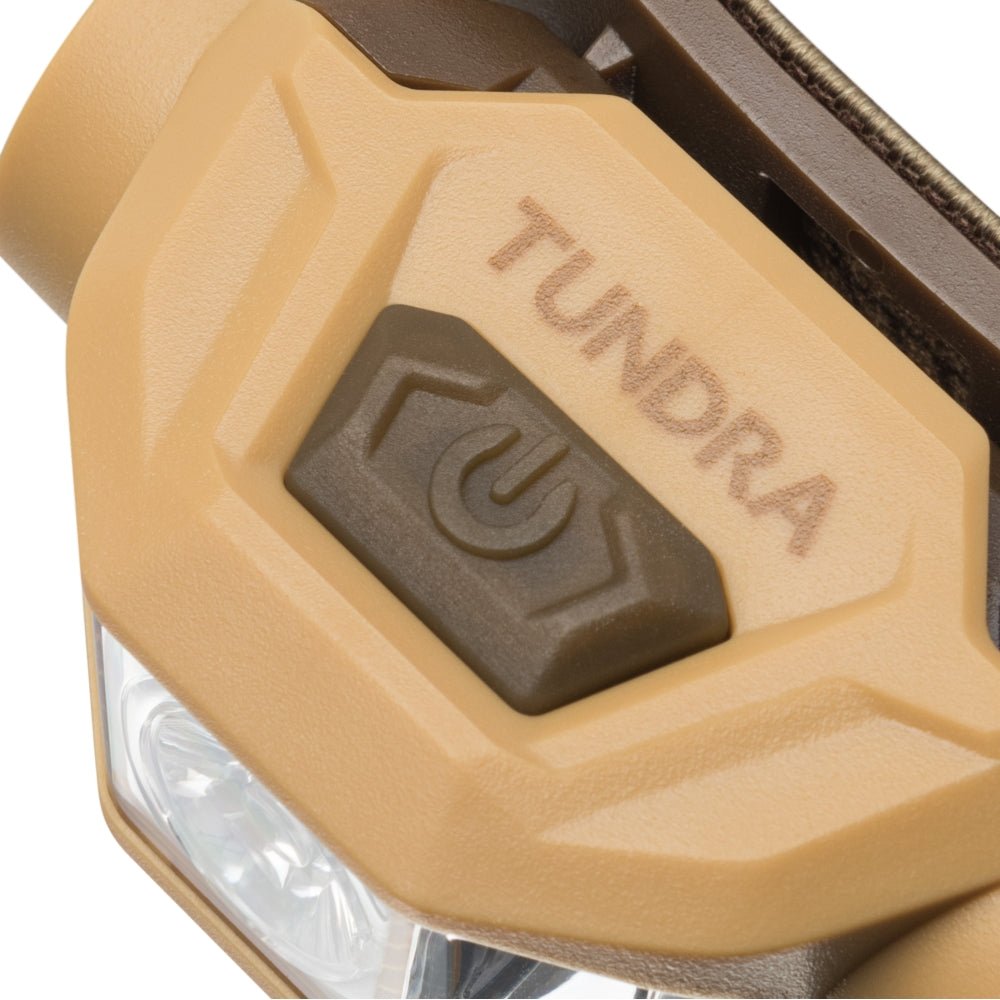 Mactronic Tundra Ein-Aus-Schalter oben auf der Stirnlampe mit dem Schriftzug Tundra